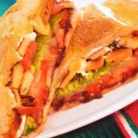 Milanesa De Pollo Torta · Grilled steak and onions, with eggs, and melted cheese. Traditional Mexican sandwich, served...
