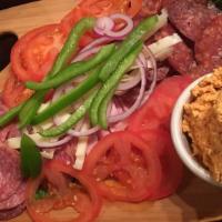 Hungarian Country Platter · Hungarian salami, sausage, ham, cheese, red onion, and green peppers served with bread. Add ...