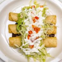 Queso Flautas  · Cheese. Served with black beans, lettuce, cheese and sour cream.