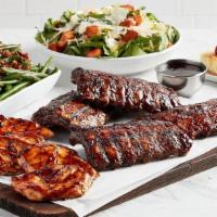 Ribs & Chicken · Two racks of slow-roasted and grilled pork ribs glazed in BBQ sauce and four marinated wood ...