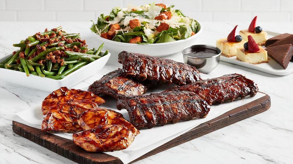 Ribs & Chicken · Two racks of slow-roasted and grilled pork ribs glazed in BBQ sauce and four marinated wood grilled chicken breasts with Smoked Jack Sauce (on side). Served with your choice of a salad and side. Comes with dessert. Serves 4-6. No substitutions, please.