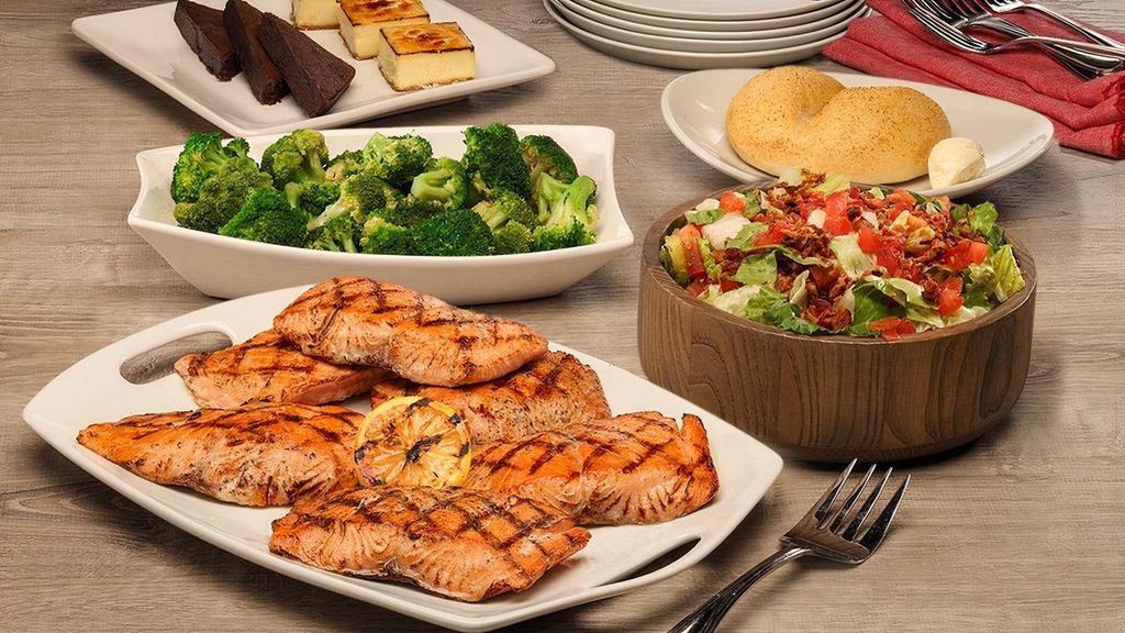 Wood Grilled Salmon · Wood grilled salmon fillets basted with Key lime butter. Served with your choice of a salad and side. Comes with dessert. Serves 4-6. No substitutions, please.