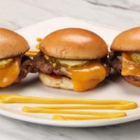 Beef Sliders* · Three USDA Choice mini burgers with Tillamook cheddar cheese, sauteed onions, yellow mustard...