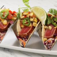 Seared Tuna Tacos · with crispy cabbage and charred corn salsa