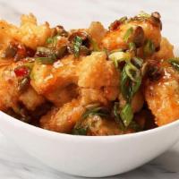 Crispy Cauliflower · Tossed in Thai chili sauce with green onion and pumpkin seed.