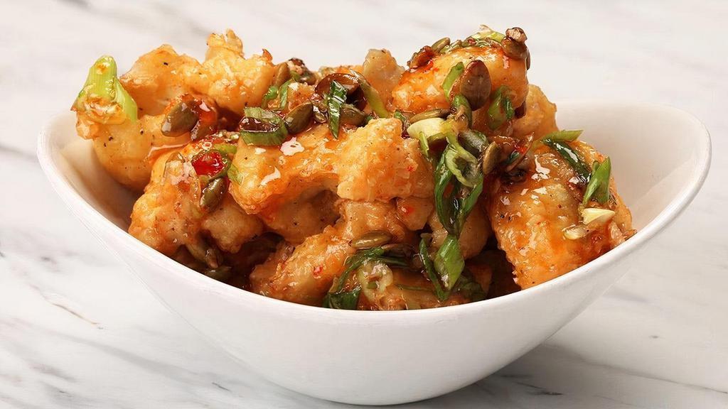 Crispy Cauliflower · Tossed in Thai chili sauce with green onion and pumpkin seed.