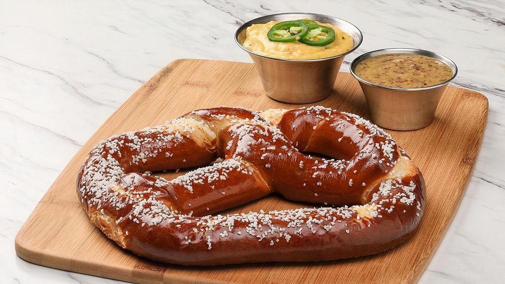 Everything Pretzel · Giant German-style soft pretzel with beer cheese fondue and everything seasoning