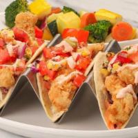 Fish Tacos · Grilled or crispy, cabbage, charred corn salsa, spicy Sriracha sour cream