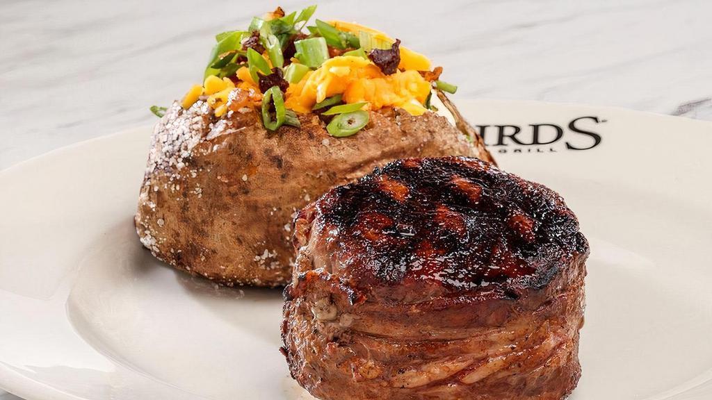 Filet Mignon*  · Center-cut, wrapped in applewood-smoked bacon