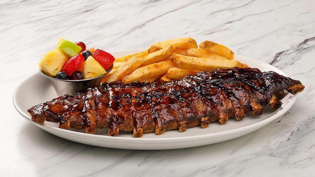 Baby Back Ribs · Slow-roasted and grilled, java BBQ sauce, fresh fruit, choice of side