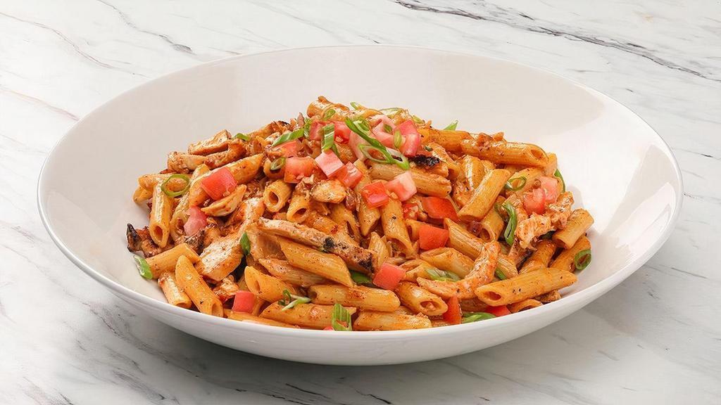 Firebirds Chicken Pasta · Spicy Asiago cream sauce, applewood-smoked bacon, green onions, tomatoes