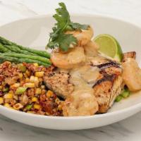 Striped Bass · Wood grilled striped bass topped with large shrimp in a Key lime butter sauce, served with a...