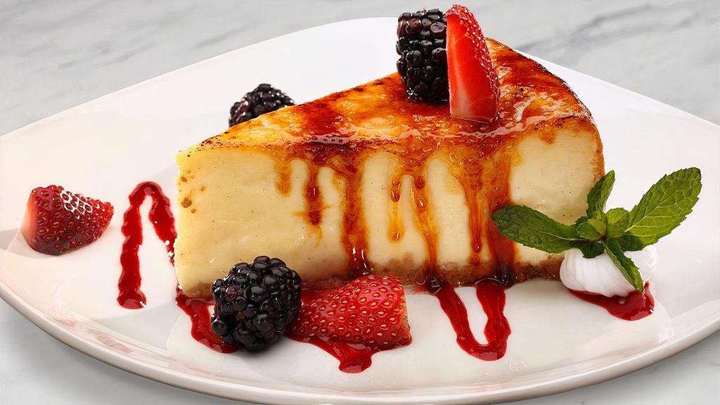 Creme Brulée Cheesecake · Bruléed to order, fresh fruit, raspberry coulis