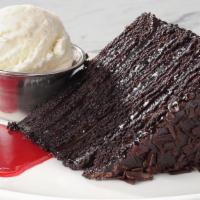 Big Daddy Chocolate Cake · Raspberry coulis and a scoop of vanilla bean ice cream