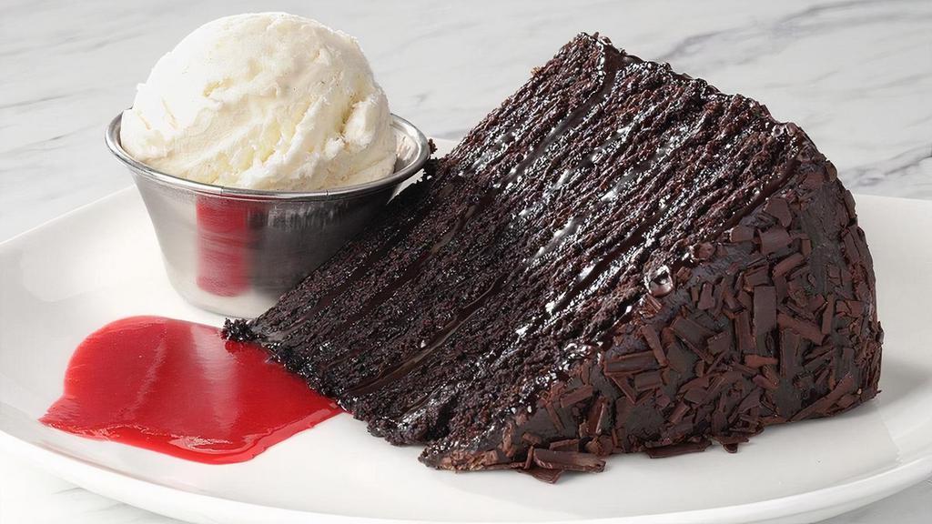 Big Daddy Chocolate Cake · Raspberry coulis and a scoop of vanilla bean ice cream