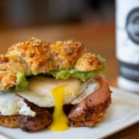 Pastrami Smoked Salmon · With two fried eggs, avocado spread on multigrain croissant.