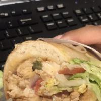 Caribbean Fiesta · Jerk chicken, chipotle gouda cheese, peppers, onions,  jalapeños, lettuce and tomato and ran...
