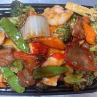 Happy Family · A union shrimp lobster, pork, beef, chicken and wild mushroom, baby corn, snow peas in our h...