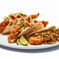 Baja Fish Tacos Fried · Tempura battered cod served on soft tortillas with pico de gallo, cabbage and house spicy sa...