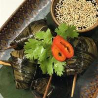 Gai Hor Bai Touy · Chicken-pandan leaves. Fried marinated chicken wrapped with pandan leaves served with thick ...