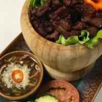 Moo Sawan · Fried marinated Thai herbs pork Served with spicy tamarind sauce.