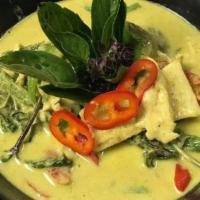 Green Curry · Popular. Served with choice of meat in curry coconut milk, bamboo shoots, eggplant, basil, a...
