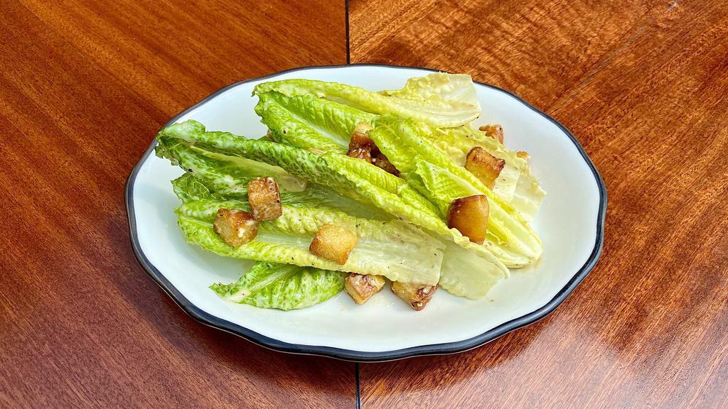 Caesar Salad · Romaine, garlic croutons, and shaved parmesan