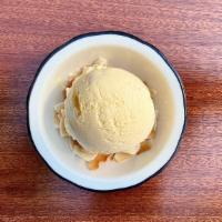 Ice Cream · A blend of toasted coconut ice cream and tangy sweet pineapple ice cream on a bed of flaked ...