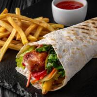 Gyro With Fries · Flavorful gyro and golden fries, served with lettuce, tomato, onion, and white sauce.
