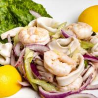 Calamari Shrimp Salad · Red onion, celery, garlic, lemon and olive oil.