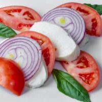 Caprese Salad · Fresh mozzarella, red onion, tomato, basil, olive oil and vinegar.