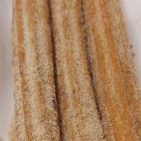 Churros  · Comes with 2-10inch Mexican style caramel filled churros sprinkled in cinnamon sugar