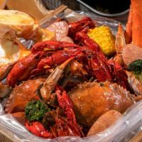 #2 Combo Blue Crab 2 Crabs 1/2 Crawfish 1/2 Shrimp (Head Off)  · Served w/ 2 corn and 2 Potatoes  and Choice of Your Favorite Seasonings and Spice Level!