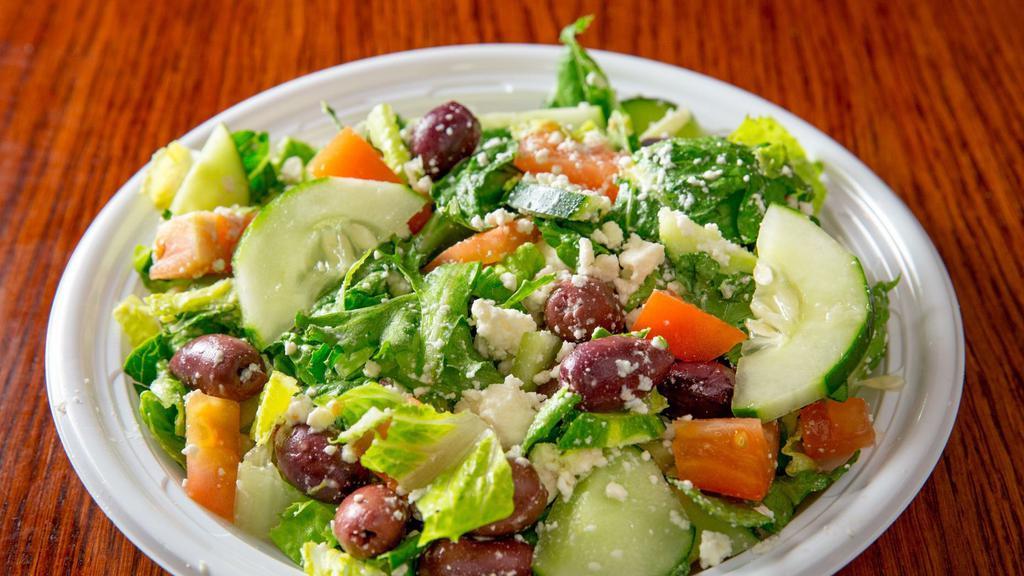 Greek Salad With Chicken · Lemon chicken breast, Feta cheese, onions, tomatoes, cucumbers, Kalamata olives over Romaine. All salads come with Romaine mix, cucumbers, tomatoes and are mixed with a dressing of your choice.