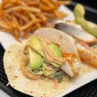 Seabass Tacos · two (2) seabass tacos in flour tortillas, topped with mango slaw, sliced avocado & chipotle ...