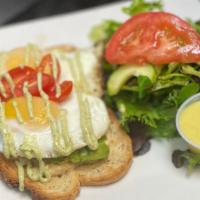Hummus Avocado Toast · multi-grain toast, hummus, and sliced avocado, topped with 2 sunny side up eggs, served with...