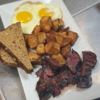 Steak & Eggs · Grilled marinated hanger steak topped with two sunny-side up eggs and home fries.
