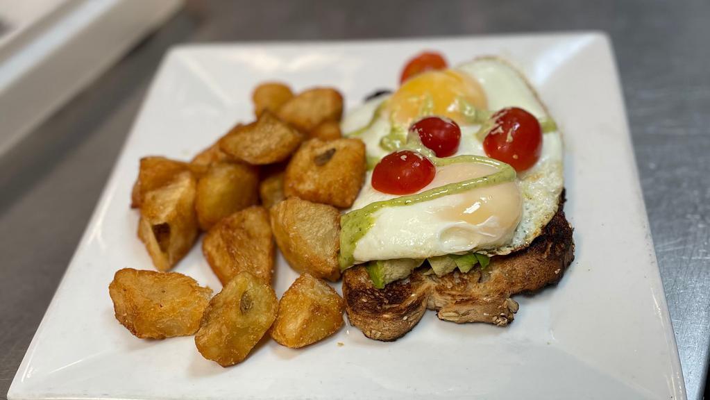 Avocado Toast · multigrain toast topped with 2 sunny side up eggs, sliced avocado & cherry tomatoes, herb aioli, served with home fries or house salad