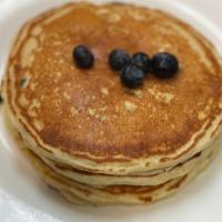 Blueberry Pancakes · Stone ground organic whole wheat batter sweetened with a touch of honey.