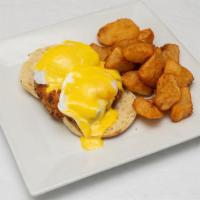 Crab Cake Benedict · crab cake served over toasted english muffin, topped with 2 sunny side up eggs & hollandaise