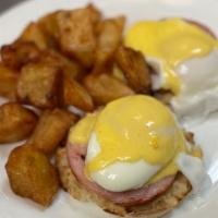 Eggs Benedict · Poached eggs and Canadian bacon on an English muffin topped with hollandaise.