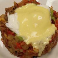Pulled Pork Benedict · Roasted corn and yucca hash with pulled pork, topped with guacamole, two poached eggs and ci...