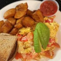 California Scramble · Eggs scrambled with avocado, tomato, and jack cheese with a side of salsa.