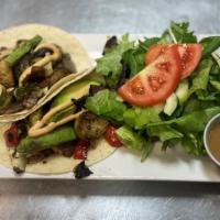 Vegan Veggie Tacos · two (2) tacos, roasted portobello mushrooms, cauliflower, onions, brussel sprouts, avocado &...
