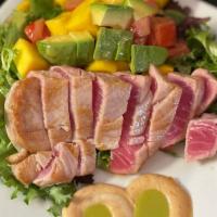 Yellowfin Tuna Salad · Seared sushi grade tuna with a chipotle, cilantro and lime sauce, mixed greens, mango, avoca...