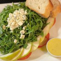 Arugula & Pear Salad · Arugula, tomato, sliced anjou pear, tomato and crumbled gorgonzola with citrus vinaigrette.