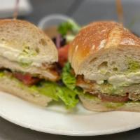 Classic Cutlet · Buttermilk fried chicken cutlet, fresh mozzarella, pesto mayo, lettuce and tomato on baguette.