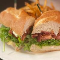 Sweet Basil’S Blt · Melted Brie, arugula, tomato and applewood smoked bacon on a baguette with mayo or honey mus...