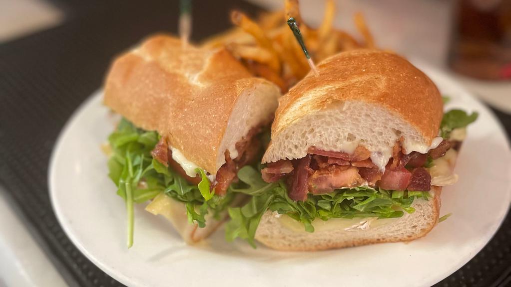 Sweet Basil’S Blt · Melted Brie, arugula, tomato and applewood smoked bacon on a baguette with mayo or honey mustard.