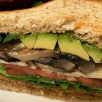Veggie Sandwich · roasted portobello mushroom, fried eggplant, tomato, arugula & fresh avocado, drizzled with ...